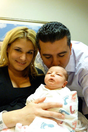 Mommy and Daddy shower their new bundle with plenty of love.