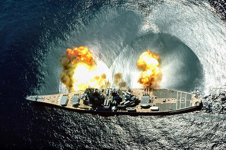 USS Iowa (BB-61) fires a full broadside of her nine 16"/50 and six 5"/38 guns during a target exercise near Vieques Island, Puerto Rico.