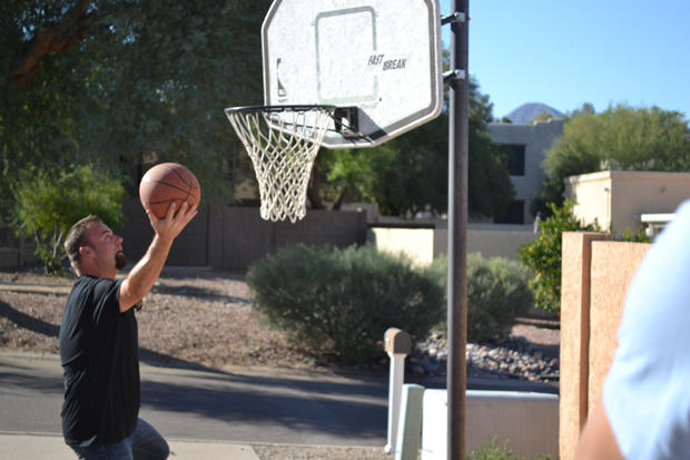 Steve Simons throws some hoops before checking out the inside of a property.