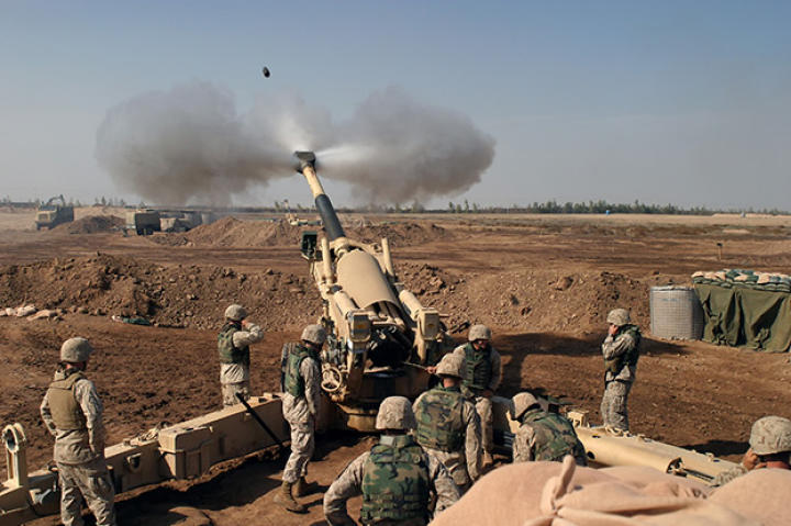 An M-198 155mm Howitzer of the US Marines firing at Fallujah, Iraq, during the Second Battle of Fallujah