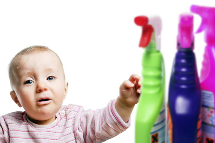 A baby with household cleaners