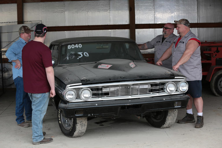 Tommy Christmas and Steve McGranahan working on a car deal.
