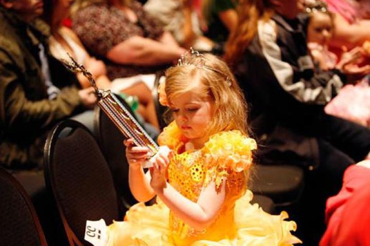 Contestant with trophy.