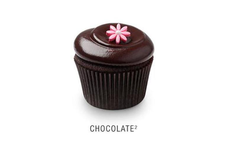 Feast your eyes on these irresistible creations from Georgetown Cupcake. First up:
Chocolate Squared
Valrhona chocolate cupcake with a whipped Callebaut chocolate frosting topped with a fondant flower.