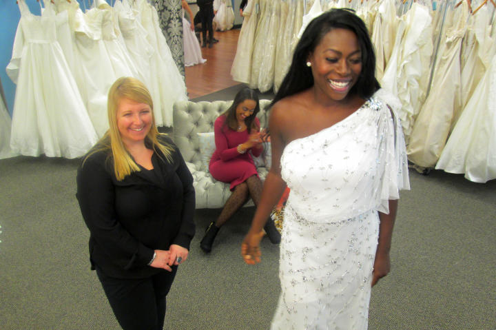 Tohni's reception dress was this one-shoulder beaded gown -- she looked cool and effortlessly chic in the style. The Pronovias design sold for $1,850, but Tohni got it at Vows for only $499. (Not a typo: just $499!)