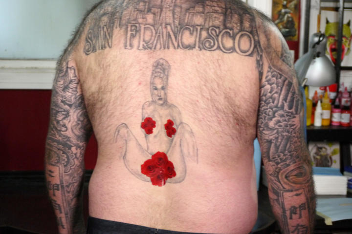 Before: Mark shows his ‘before’ tattoo, with strategically placed stickers.