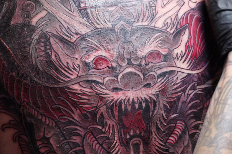 After: Tattoo artist Jeremy Swan gave Mark a massive cover-up on his back to replace his old tattoo.