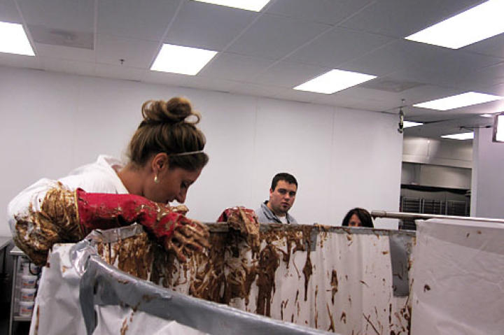 Katherine gets a little messy (but still looks glam!) working on this giant cupcake.