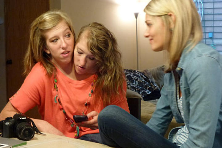 Abby & Brittany hang out with roommate Katy, in their kitchen.