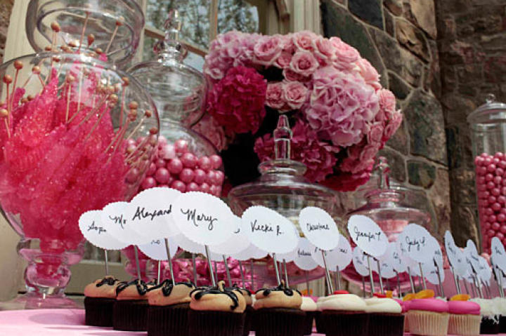 Guests found their way to their seats by matching cupcakes with their names to cupcake table names.