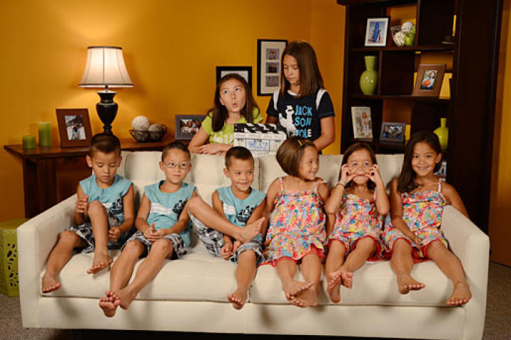 The family gathers around for a little fun on the famous couch they've spent so much time on.