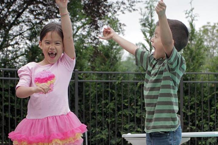 Hannah and Joel jump for joy over the official opening of the Gosselin family pool.