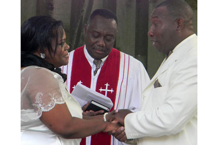 Penny and her groom exchange vows.