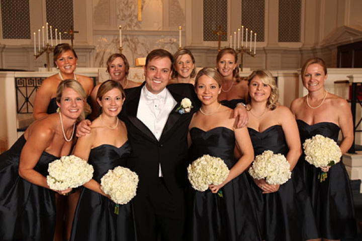 John cozies up to Stephanie's bridesmaids.