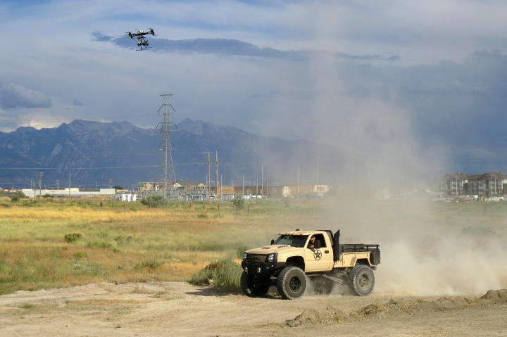 The aerial drone follows alongside the completed Duramax Diesel truck.