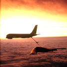 With a beautiful backdrop a KC-135 Stratotanker from McConnell Air Force Base, Kansas, refuels a B-2 Spirit Bomber.