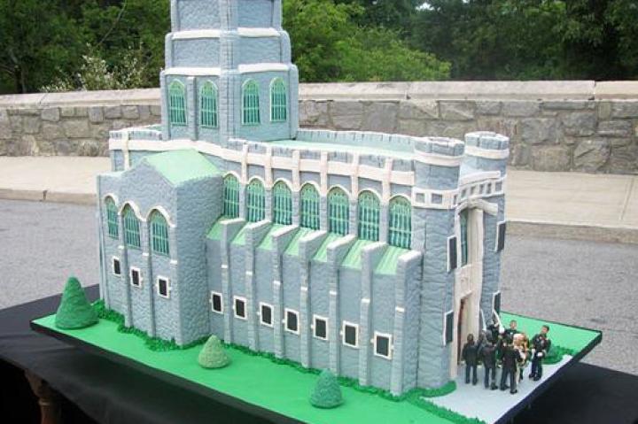 WEST POINT CAKE
How was the cake made?
The cake was made of chocolate cake, chocolate fudge, vanilla buttercream, Rice Krispies Treats (chapel walls), gray fondant (cobblestone walls), fondant and edible ink (DecoPac printed stained glass windows), green buttercream (grass), and modeling chocolate (sculpted soldiers, couple getting married).
What's memorable about the cake?
When making cakes that resemble buildings and delivering that cake to that building, it's imperative the cake resembles the building to a tee. Remy had a hard time getting the roofline just right but luckily Buddy noticed it didn't match the photos of the chapel. They were able to fix it before the cake went out the door...whew!
Click "Next" to see the next sketch.