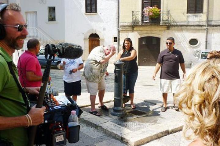 Mauro and the family take a minute to cool down at a drinking fountain in Altamura.