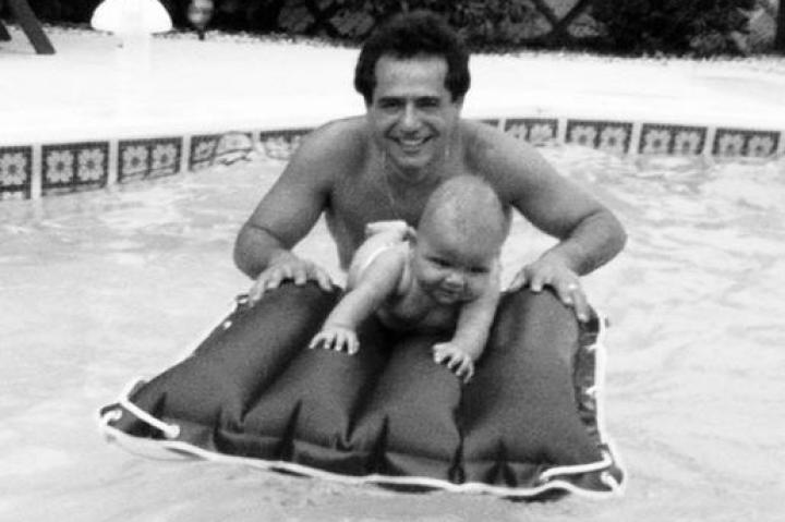 Before he was even a year old, Buddy was making big waves with firsts. Baby Buddy takes his first swim with Dad.