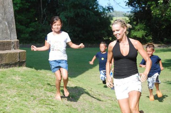 Kate, Mady, Collin, and Aaden running around the lighthouse.