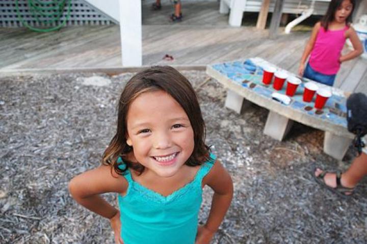 A smiling Alexis at the beach house.