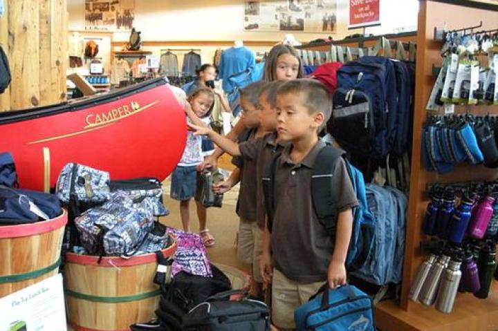 Collin, Aaden, and Joel check out the lunch boxes.
