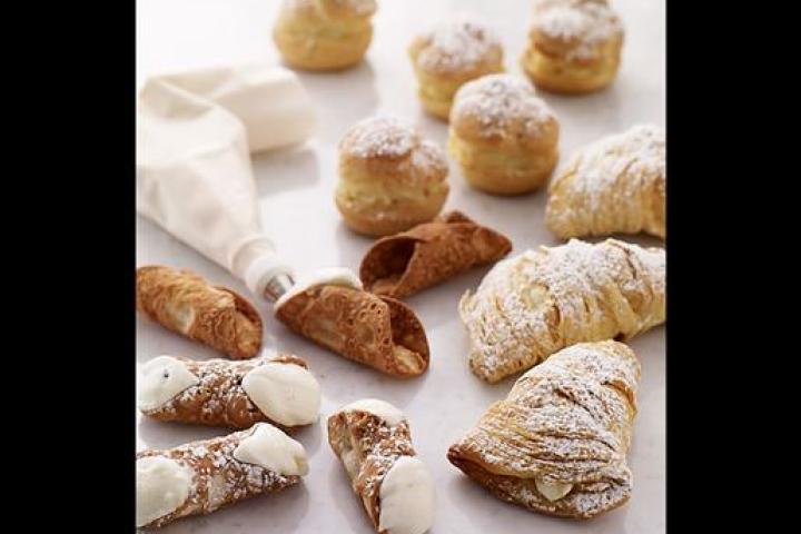 Freshly filled (from lower left corner) Cannoli, Cream Puffs and Lobster Tails. Pipe them with cream just before serving to preserve the character of the pastry.