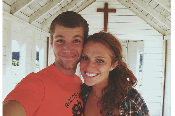 The happy couple poses in the