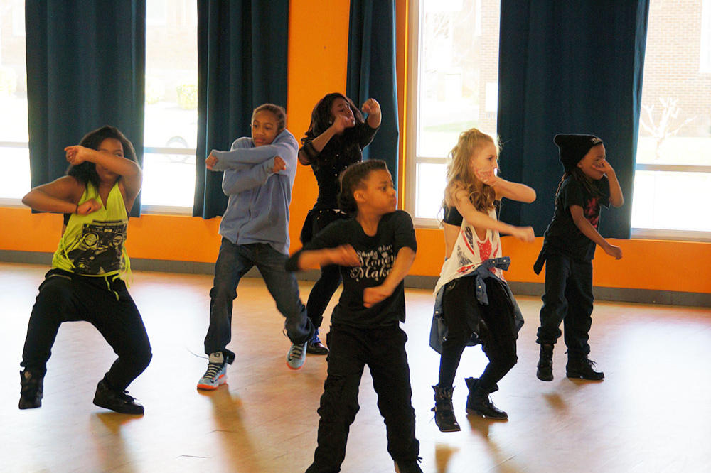 The kids try an 8-count just moments after their choreographer shows it to them.