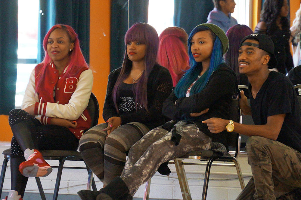 The OMG Girlz and choreographer Sean Bankhead watch as the kids perform.