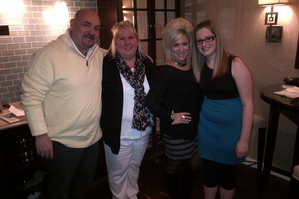 Theresa Caputo with contest winner Tina Maria and her husband and daughter.