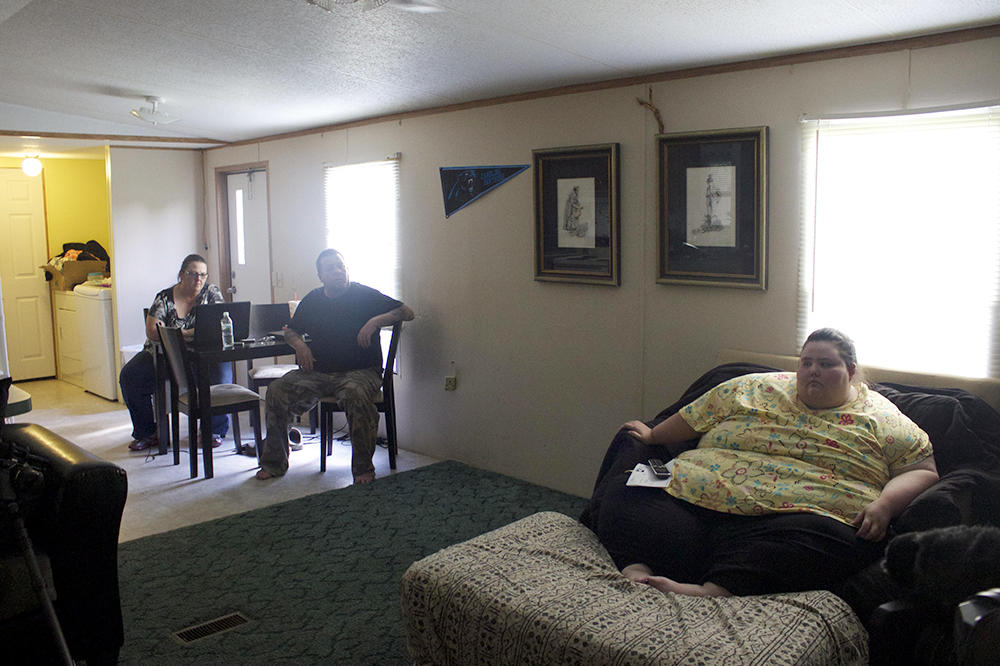 Christina sits apart from her family at mealtime. "My family doesn't realize how hard it is to watch them eat what I want," she says.