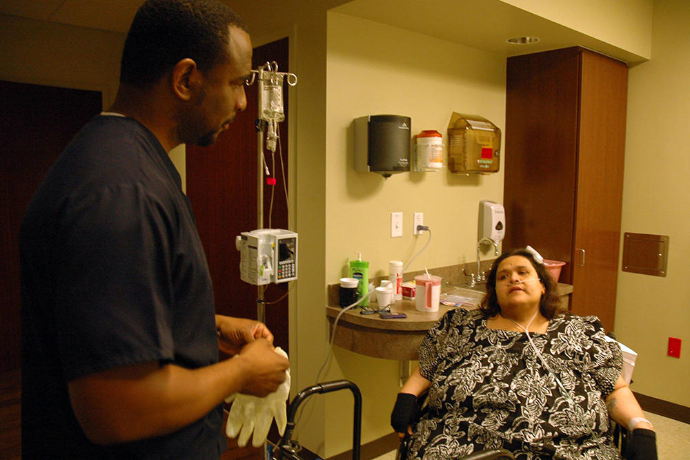 Before Olivia's surgery was arranged, she underwent a 48-hour observation period at the hospital. During that time, nurses like this one worked with her on tasks like balancing and walking.