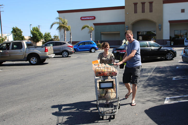 Kirlyam pushes the grocery cart as Alan helps guide it. It seems like an everyday task, but it's new to her!