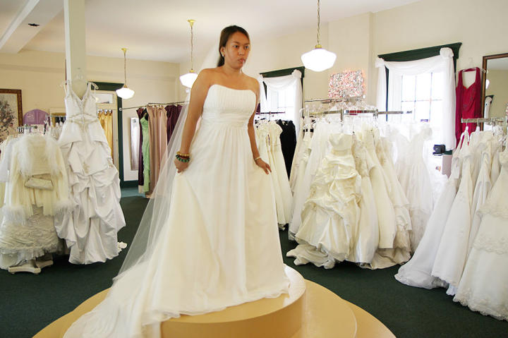 Aya falls for this classic A-line wedding gown -- it's perfect, and despite her recent weight gain that's made her self-conscious, she feels absolutely beautiful.
