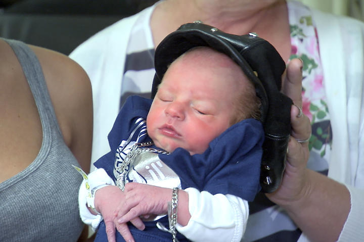 Just a few days old here, and already Mellie's baby Richard is one of the best-dressed kids around, thanks to gypsy dressmaker