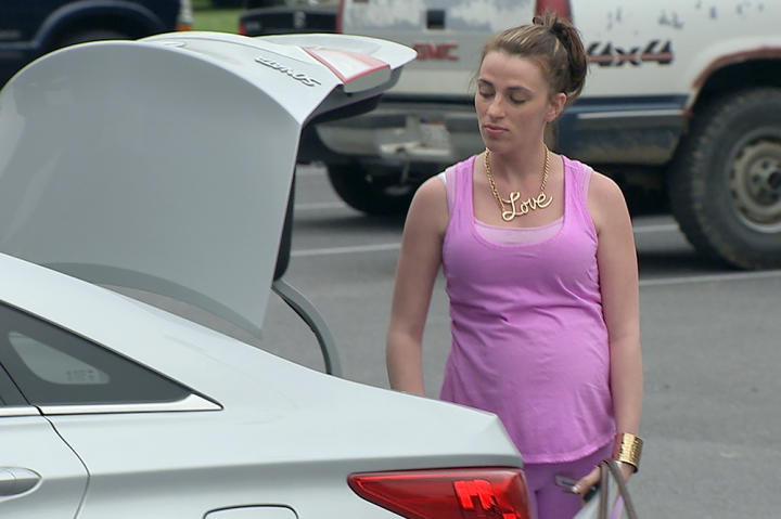 Staying true to her monochromatic style but varying the palette, Mellie is pretty in pink while shopping for baby gear.