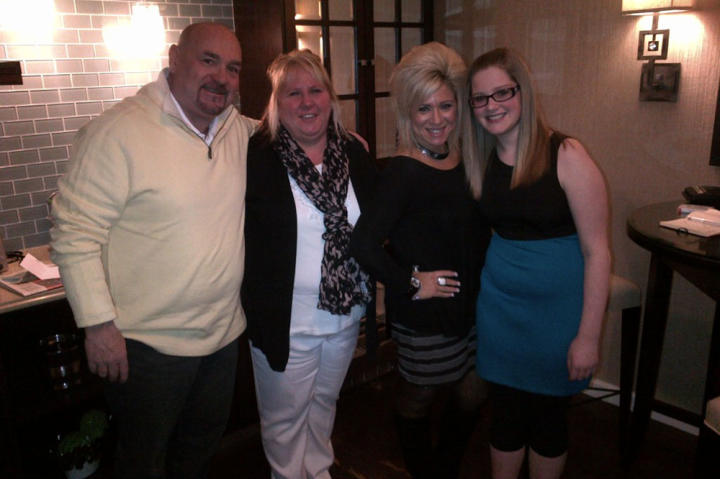 Theresa Caputo with contest winner Tina Maria and her husband and daughter.