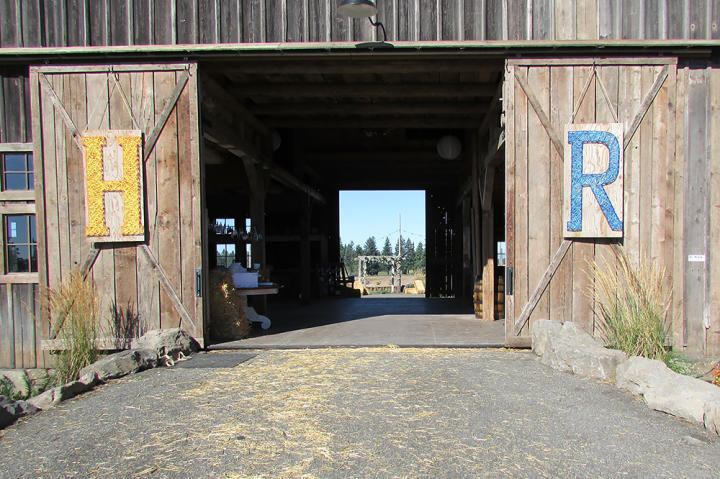 More string art representing Hannah and RJ's initials decorates the barn.