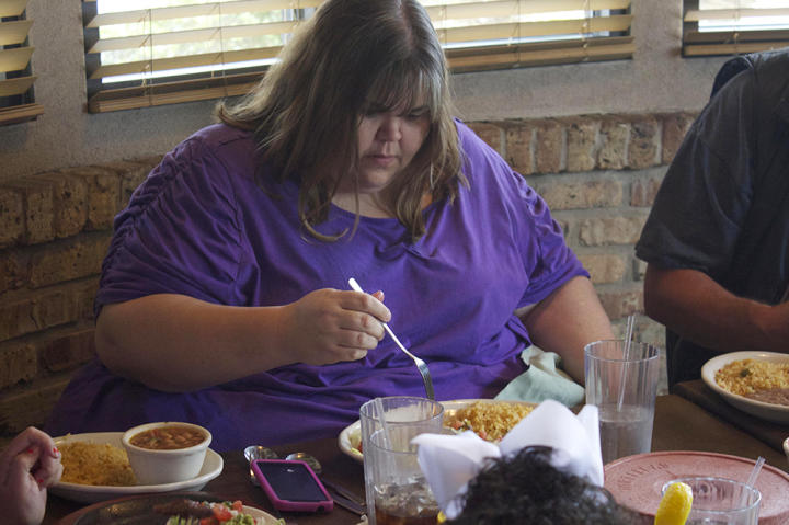 At a Mexican restaurant, Zsalynn order steamed fish and rice -- and avoids the temptation of chips and salsa. She's working to lose weight so she can have surgery.