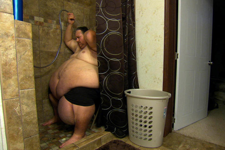 Chuck showers at home. "I'd rather be a dead man than have to live like this for the rest of my life," he admits.