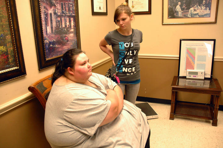 Christina is 22 years old and weighs 673 pounds. "I never thought I'd get this big," she explains, but at her size, she can't drive and isn't motivated to leave her house. Here, she waits for a consultation with weight-loss surgeon Dr. Nowzaradan.
