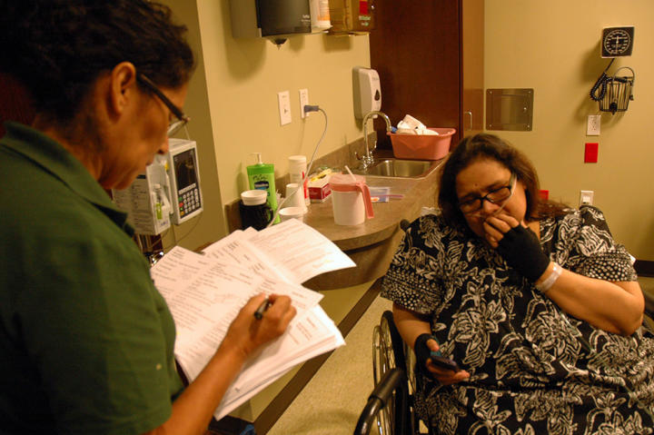 Olivia describes her current state of mental and physical distress to a nurse at the hospital.