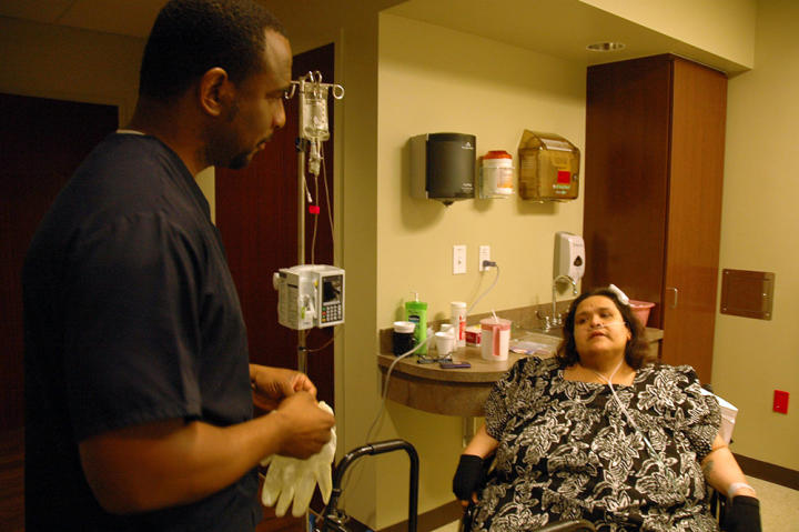Before Olivia's surgery was arranged, she underwent a 48-hour observation period at the hospital. During that time, nurses like this one worked with her on tasks like balancing and walking.