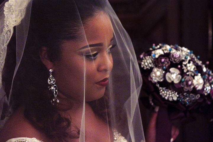 Chandelier earrings, smoky eyes and a matte lip add drama to Terron's Something Borrowed look.