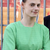 The fighting in the house when Sam arrives makes Betsy very uncomfortable. She's suspicious of Matt and his intentions, but he's the only housemate who gives Betsy the benefit of the doubt when she talks about witchcraft. "I've experienced it firsthand," she says, but that doesn't mean she wants to be ostracized from the other girls.