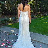Jenny in her wedding dress from behind.