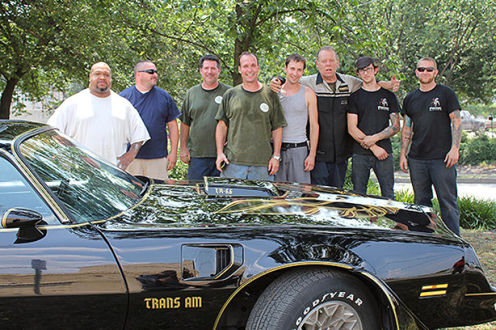 Dan and some of the crew pose with a finished Trans Am.