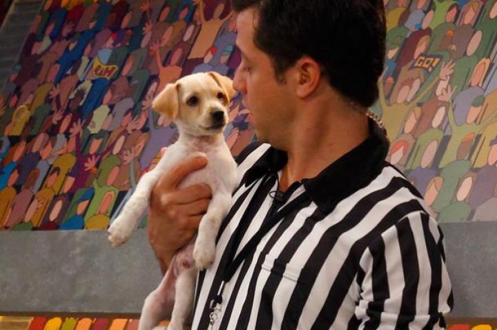The Ref bonds with a pup.