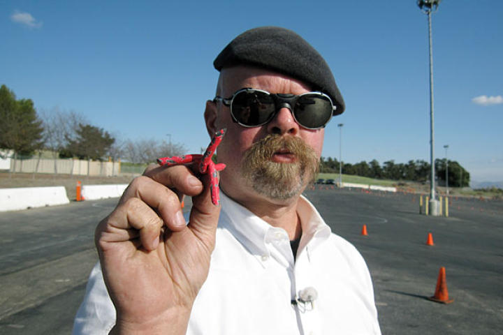 Jamie Hyneman shows off the tire spikes used to thwart a pursuing vehicle in Spy Car Escape.